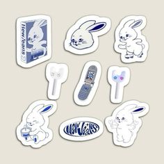 various stickers with an image of rabbits and cell phones on them, all in different designs