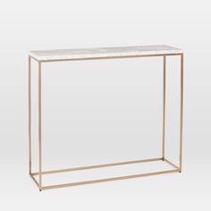 a white marble and gold metal console table