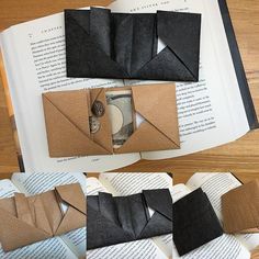 an origami envelope is open on top of some books