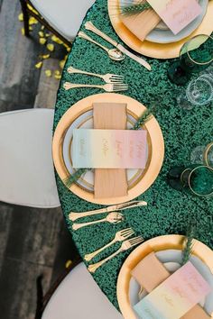 the table is set with place settings for guests to sit down and enjoy their meal