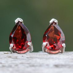 In jewelry, it is often believed that the pear cut represents a tear of joy, making this gemstone shape prominent in glamorous accessories. Drawing inspiration from refined trends, Thailand's Roongnapa presents these sterling silver drop earrings with two natural garnet jewels in a faceted style and pear shape, symbolizing perseverance and totaling one carat. Teardrop Jewelry With Prong Setting As Gift, Elegant Pear-shaped Faceted Earrings, Elegant Faceted Pear-shaped Earrings, Sterling Silver Pear-shaped Teardrop Earrings, Sterling Silver Pear-shaped Teardrop Earrings, Fine Jewelry, Formal Faceted Teardrop Earrings, Fine Jewelry Sterling Silver Teardrop Earrings, Fine Jewelry Teardrop Earrings With Prong Setting, Fine Jewelry Pear-shaped Teardrop Earrings In Prong Setting