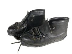 two pairs of black shoes with laces on them