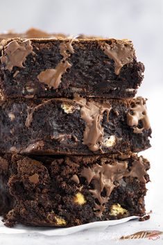 three chocolate brownies stacked on top of each other