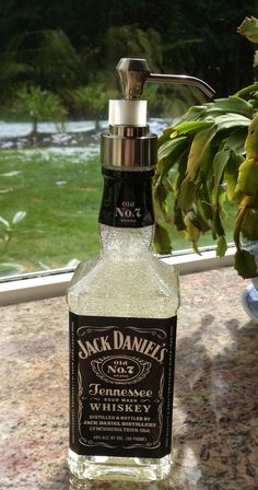 Perfect for any barber whose brand has a bit of an edge to it! #JD http://www.phorest.com/blog/2014/11/23/fantastic-salon-diy-ideas/#.VIbMWzGsW90 #LetsGrow #Salons #Upcycling #SalonUpcycling #DIYDecor #DIY Barber Station, Barbershop Ideas, Speakeasy Party, Whiskey Bottles, Jack Daniels Bottle