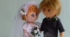 a wedding cake topper with a bride and groom