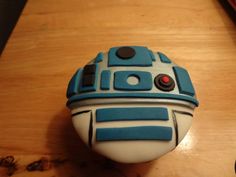 a blue and white object sitting on top of a wooden table