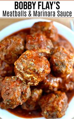 meatballs and sauce in a bowl with the words bobby flay's meatballs and sauce