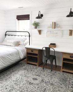 a bedroom with a bed, desk and chair