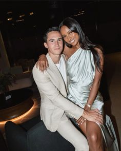 a man and woman posing for a photo together