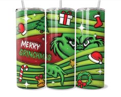 three green christmas candles with santa's stockings and candy canes on the bottom