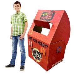 a young boy standing next to a cardboard box with the words are you ready?