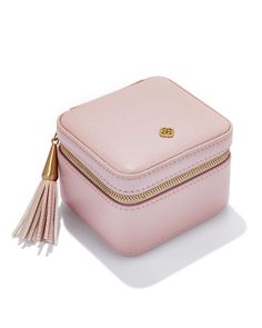 Our favorite travel companion, pretty enough to sit on your vanity, perfectly sized to throw in your tote. Whether you’re headed on vacation or are never not fashionably late, on-the-go accessorizing has never been easier with the Small Travel Jewelry Case in Blush Pink. Metal Gold Plated Brass Material Polyurethane, 100% Polyester Lining Size 4"L x 3.625"D x 2.75"H Closure Zipper closurePlease note: Due to the one-of-a-kind nature of the medium, exact colors and patterns may vary slightly from the image shown. | Kendra Scott Small Zip Jewelry Case in Blush Pink | Polyurethane Pink Everyday Travel Pouch, Pink Rectangular Travel Accessories For On-the-go, Chic Pink Compact Bag, Chic Compact Pink Bag, Feminine Cosmetic Bag For Travel, Pink Rectangular Travel Accessories Gift, Rectangular Pink Travel Accessories For On-the-go, Feminine Travel Cosmetic Pouch Bag, Pink Kendra Scott