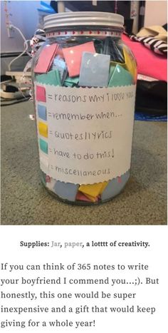 a jar filled with lots of notes on top of a table