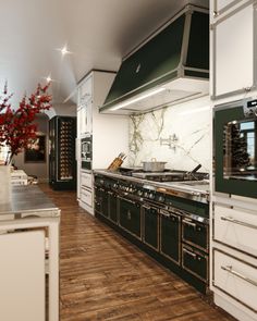 a kitchen with an oven, stove and counter tops in it's center island