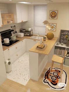 a small kitchen with white cabinets and wooden counter tops, along with a tiger rug on the floor