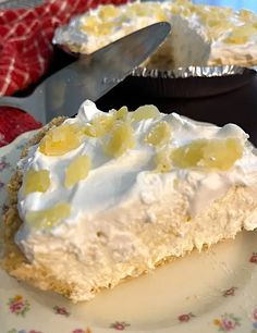 a piece of pie sitting on top of a white plate next to a knife and fork