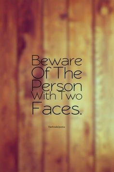 a wooden wall with the words beware of the person with two faces