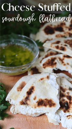 cheese stuffed quesadillas with sourdough flatbread on a cutting board