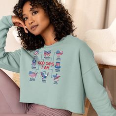 Celebrate your faith and patriotism with our "God Says I Am" Crop Sweatshirt. Perfect for the 4th of July, this inspirational Christian tee showcases USA pride. It's an ideal faith-based gift for her, combining style and comfort in a meaningful way. Did you know that fashion and comfort can be combined? This fleece crop sweatshirt is here to prove the point. The soft fabric feels extra soft to the touch, and the trendy cut with a ribbed neckline and raw hem comes right out of fashion magazines while still keeping it casual. * 52% airlume combed and ring-spun cotton, 48% poly fleece * Fabric weight: 6.5 oz/yd² (220.39 g/m²) * Ribbed crew neckline and cuffs * Dropped shoulder cut * Cropped body with a raw hem * Side-seamed * Blank product sourced from Nicaragua This product is made especiall Patriotic Crew Neck Relaxed Fit Top, Veterans Day Flag Print Crew Neck Top, Casual Letter Print Tops For Veterans Day, Long Sleeve Cotton Tops For 4th Of July, Cotton Long Sleeve Top For 4th Of July, Patriotic Letter Print Top For Veterans Day, Patriotic Independence Day Tops With Relaxed Fit, Patriotic Tops For Independence Day With Relaxed Fit, Patriotic Letter Print Sweatshirt For Independence Day