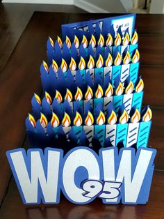 the birthday candles are stacked on top of each other with the word wow in blue