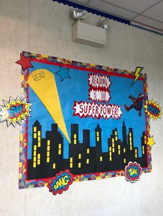 a bulletin board with an image of a rocket ship in the sky and buildings on it