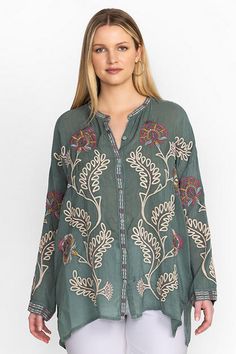 Crafted from a lightweight flowing fabric, the Martina Slim Audrey Tunic is enhanced with intricate floral placement embroidery. Featuring a rounded collar and relaxed drop sleeves, this vibrant and bold blouse is finished with a contrasting button placket. Pair with fitted leggings and smart flats for an elevated weekend look. Women's Slim Audrey Tunic by Johnny Was in Verdigris Green, Size XL, Floral Relaxed Fit V-neck Embroidered Top With Floral Embroidery, Relaxed Fit V-neck Top With Floral Embroidery, Relaxed Fit Blouse With Floral Embroidery, Embroidered Green Blouse For Fall, Spring V-neck Tunic With Embroidered Neckline, Fall Bohemian Blouse With Embroidered Neckline, Green Blouse With Floral Embroidery And Relaxed Fit, Bohemian Blouse With Embroidered Neckline For Fall, Spring Embroidered V-neck Top With Relaxed Fit