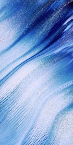 an abstract blue and white background with waves