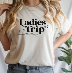 "Friends Girls Trip T-Shirt, Cheaper Than Therapy, Friends T-Shirts, personalised matching Holiday tops. Best Friends Gift.  This listing is for a high quality bespoke ladies T-shirt that is a hand made item, made to order. Personalised Tee that says \"Ladies trip\" which are perfect for your best Girl Friends. Our Personalised T-shirt is handmade with the finest machinery ensuring the ultimate quality for you. This listing is for a high quality Ladies T-shirt that is a hand made item, made to order. Our t-shirts are handmade with the finest machinery ensuring the ultimate quality for you. Using only premium  tees, your handmade T Shirt will be SUPER soft and SUPER comfy Material: Luxuriously 100% Cotton, Breathable, and super Soft Material. Handmade Quality: Crafted with the finest machin Family Matching T-shirt, Naruto T Shirt, Cheaper Than Therapy, Long Sleeve Baseball Tee, Personalized Matches, Crop Top And Leggings, Best Girl, Girl Friends, Friends Tshirt