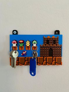 a key holder made to look like an old school video game