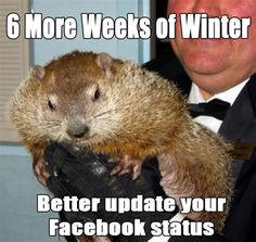 a man in a suit and tie holding a groundhog on his lap with the caption 6 more weeks of winter better update your facebook status