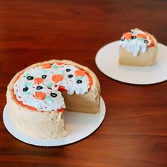 two cakes with frosting and sprinkles on plates