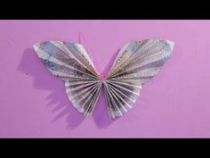 an origami butterfly made out of money