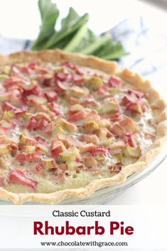 a close up of a pie on a plate with vegetables in the background and text that reads classic custard rhubarb pie