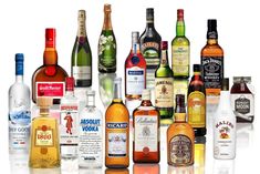 many different types and sizes of alcohol bottles are arranged in a pyramid on a white background