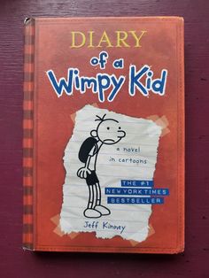 a book with the title diary of a wimpy kid written on it