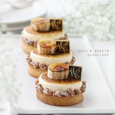 small desserts are arranged on a white plate