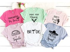 five different colored shirts with mexican sayings on them