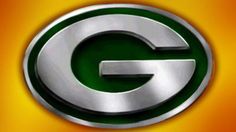 the green bay packers logo on an orange and yellow background with silver letters that spell out the letter g