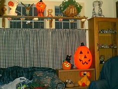 a living room filled with furniture and halloween decorations