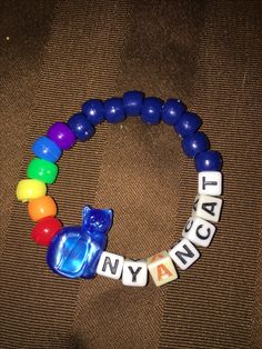 a bracelet that says, i love my cat and is made out of plastic beads