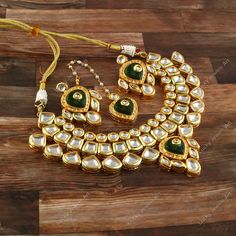 This is a stunning handmade necklace perfect for high end Jewelry Collector, a keeper in Traditional Vintage Indian/Pakistani Bridal jewelry and a Luxury Gift for your Daughter, Sister or Wife on Wedding or Anniversary. Perfect for any type of occasions, weddings And celebrations and a beautiful & memorable gift for weddings and special occasions. -Item Code:- -Polki Diamond Necklace Set with Earrings & Tika. -Designer Meenakari Kundan Necklace. -Gold Plated Set with Kundan Stones which shine like Polki Diamonds. -Metal: Gold plated brass -Earrings are 48mm long & 35mm wide approx -Tika length is 5" approx -Push Back Earrings -Necklace length adjustable w/ dori/cord -Quantity:- One Necklace Set Please see more different designs here:- https://www.etsy.com/in-en/shop/LUCKYJEWELSART?ref=sell Luxury Traditional Brass Bridal Necklace, Luxury Diamond Kundan Necklace With Meenakari, Luxury Brass Bridal Necklace Gift, Luxury Gold-plated Kundan Necklace For Celebration, Luxury Gold Plated Kundan Necklace, Luxury Gold Plated Kundan Necklace For Celebration, Luxury Gold Kundan Necklace Gift, Luxury Gold-plated Kundan Necklace, Luxury Kundan Necklace For Gift