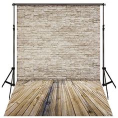 an old brick wall and wooden floor in front of a photography studio light stand with white background