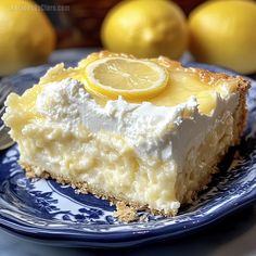 a slice of lemon pie on a blue plate