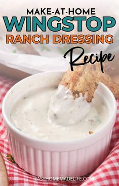 a white bowl filled with ranch dressing next to a red and white checkered table cloth