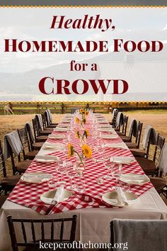 a long table covered in red and white checkered cloth with the words healthy homemade food for a crowd