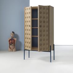 the cabinet is made out of plywood and has metal legs that are attached to it