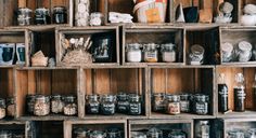 shelves filled with lots of different types of jars