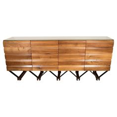 a large wooden dresser with metal legs