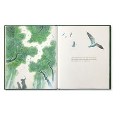 an open book with watercolor drawings and birds flying over trees in the sky,