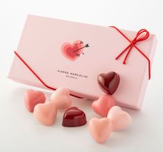 heart shaped candies in a pink gift box